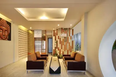 a living room with couches and a table at 18 Suite Villa Kuta in Kuta