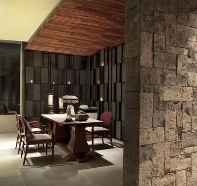 a dining room with a table and chairs at Berry Amour Romantic Villas in Seminyak