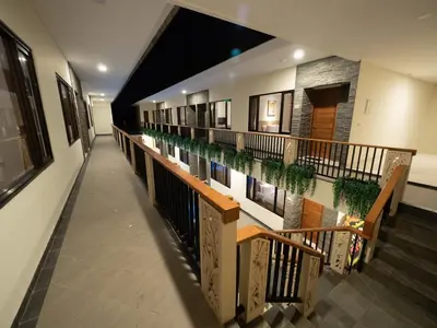 a hallway of a building with a pool of water at Metta Agara in Kerobokan