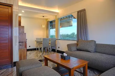 a living room with a couch and a table at Kyara Villa Apartments in Canggu