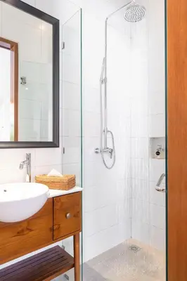 a bathroom with a sink and a shower at Villa Pandi in Seminyak