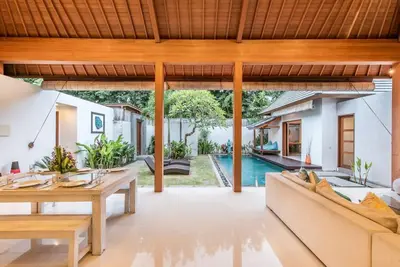 an open living room with a couch and a table at Manis, Luxury 3 Bedroom Heart of Seminyak in Seminyak