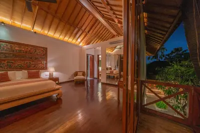 a bedroom with a large bed and a balcony at Villa Rubina - Luxury Pool Villa in Batu Belig Next to the Beach! in Seminyak