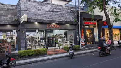a couple of people riding motorcycles in front of a store at Villa BAgus - near Seminyak beach & trendy shops, restaurants, cafes in Seminyak