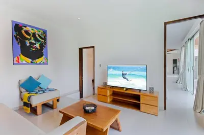 a living room with a tv and a couch at Villa Miro - Luxury, 3 Bed, Central Seminyak in Seminyak