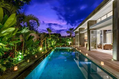 an infinity pool in a house with a villa at Aramanis in Seminyak