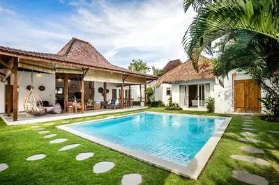 an image of a backyard with a swimming pool and a house at Villa Nakal by Alfred in Bali in Seminyak