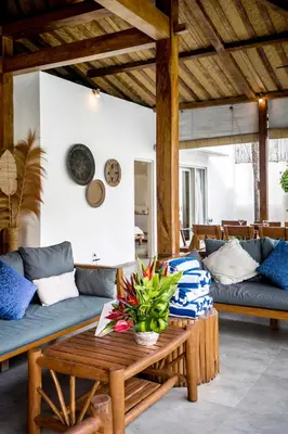 a living room with a couch and a table at Villa Nakal by Alfred in Bali in Seminyak