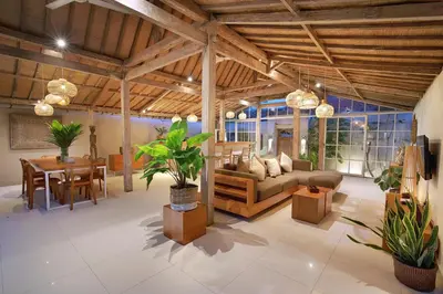 a large living room with a couch and a table at Villa Balimasan 10 mins to Canggu in Seminyak