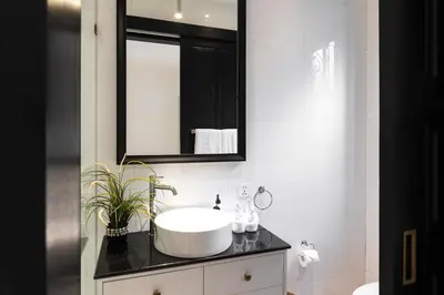 a bathroom with a sink and a mirror at Villa Opihr in Seminyak