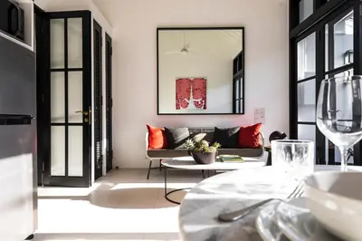 a living room with a couch and a table at Villa Saffron in Seminyak