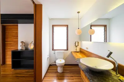a bathroom with a sink and a toilet at Villa Athena in Seminyak