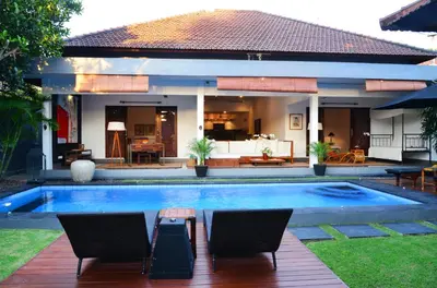 a swimming pool in the backyard of a house at Premium Villas Seminyak I in Seminyak