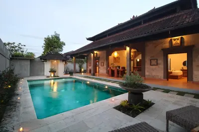 a swimming pool in the backyard of a house at Sudha Villa Bali B in Seminyak