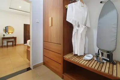 a room with a mirror and a dressing room at Sudha Villa Bali B in Seminyak