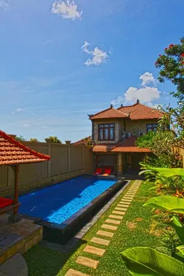 a swimming pool in the yard of a house at Villa Celavi 77 in Jimbaran