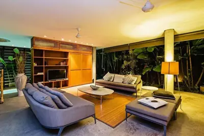 a large living room with two couches and a table at Villa C99 Seminyak in Kerobokan