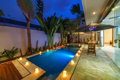 a swimming pool with lights in a house at Anema Villa Seminyak in Legian