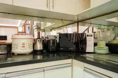a kitchen with many appliances on a counter at Villa Orange 3BR Seminyak by Exotic Bali Properties in Seminyak