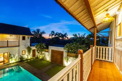 a view of a house with a swimming pool and a porch at Villa Loma by Alfred in Bali in Seminyak