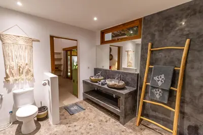 a bathroom with a toilet and a sink at Villa Hana by Alfred in Bali in Seminyak