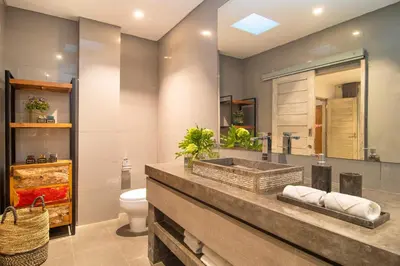a bathroom with a sink and a toilet at Villa Mia by Villa Finder in Canggu