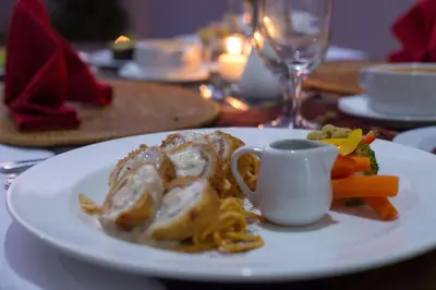 a white plate of food on a table at The Awandari Villas Seminyak in Seminyak