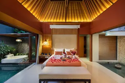 a bedroom in a villa with a bed and a tub at Seminyak Sanctuary Villa by Ini Vie Hospitality in Seminyak