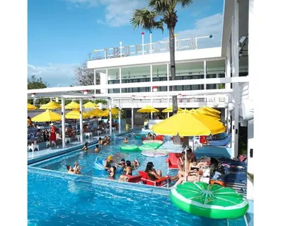 a group of people in the swimming pool at a hotel at Villa Retro 88 in Seminyak