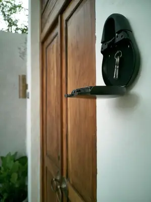 a lock on a door with a key on it at Villa Brabhan Seminyak in Seminyak