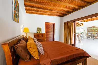 a bedroom with a bed and a window at Awesome 1BR Villa in the heart of Seminyak in Seminyak