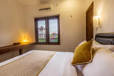 a bedroom with a bed and a window at Kuta Legian Villa 3 Bedroom Private pool in Legian