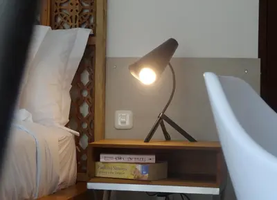 a lamp sitting on a table next to a bed at 3BR Villa Olli - Minggu Villas -Special Stay Bonus in Kerobokan