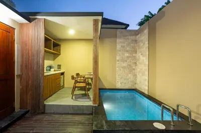 a swimming pool in the middle of a house at Radea Villa in Kerobokan