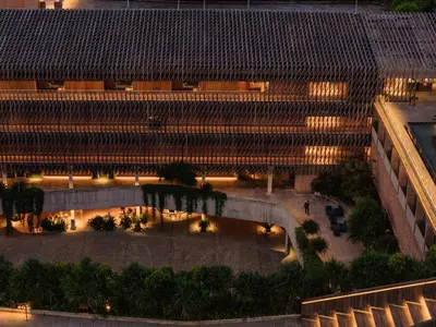 an overhead view of a building with a courtyard at night at Desa Potato Head Bali in Seminyak
