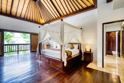 a bedroom with a bed with a canopy at Modern Private Villa Atala with Private XL Pool in Seminyak