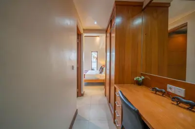 a bathroom with a wooden counter and a sink at Villa Seacluded 1 - 3BR Villa in Central Seminyak - Large Pool in Seminyak