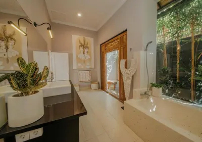 a bathroom with two sinks and a large window at Villa Bloom 5 close to the beach private pool 3 bedrooms 3 bathrooms in Seminyak