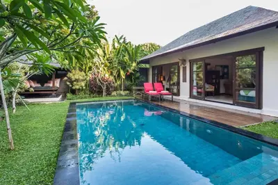 a swimming pool in the backyard of a villa at Mango Tree Villas Jimbaran Bali in Jimbaran