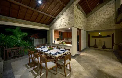 a kitchen and dining room with a table and chairs at Villa Deh Simba at Oberoi in Seminyak