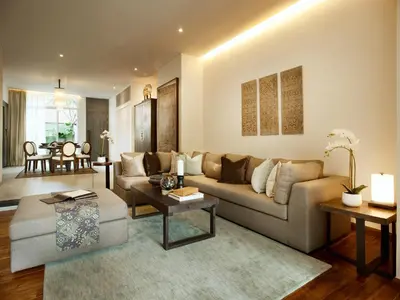 a living room with a couch and a table at hu'u Villas in Seminyak