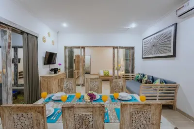 a living room with a table and a couch at Villa Cathy, Seminyak - Private 3 Bedroom Pool Villa! in Seminyak