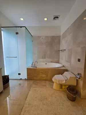 a bathroom with a tub and a toilet and a sink at Villa Akasha Luxury 6 bedroom villa near beach in Canggu