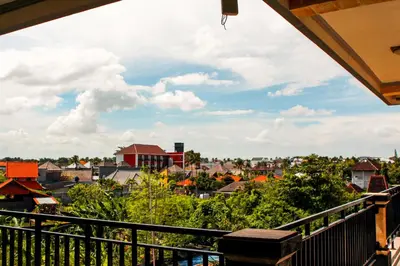 a view of a city from a balcony at Putu Guest House 2 in Canggu