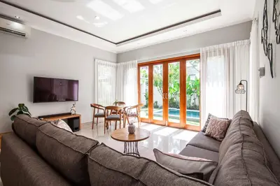 a living room with a couch and a table at Villa Voyage 4 in Seminyak