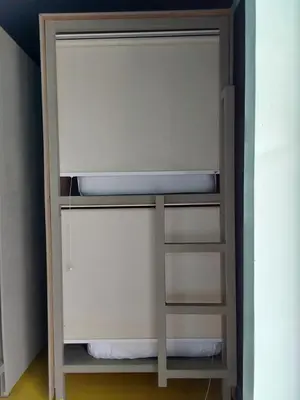 a bunk bed with a ladder in a room at Ananda Resort Seminyak in Seminyak