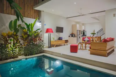 a living room and a swimming pool in a house at Villa 66, 5 min walk to Double 6 beach in Seminyak