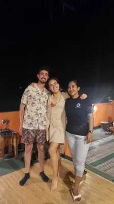 three people posing for a picture on a dance floor at Genta House in Kuta