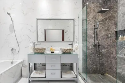 a bathroom with a sink and a shower at Saga Villas Legacy in Seminyak
