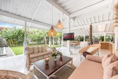 a living room with couches and a tv at Villa London - Private 4 BDR Villa in Seminyak, Pool & Garden in prime Location in Seminyak